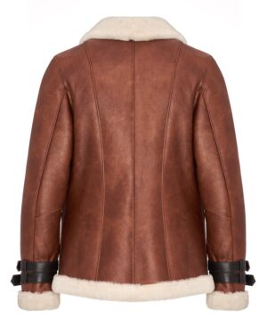 Brązowy kożuch damski z miękkim futrem przy kołnierzu i skórzanymi paskami na mankietach